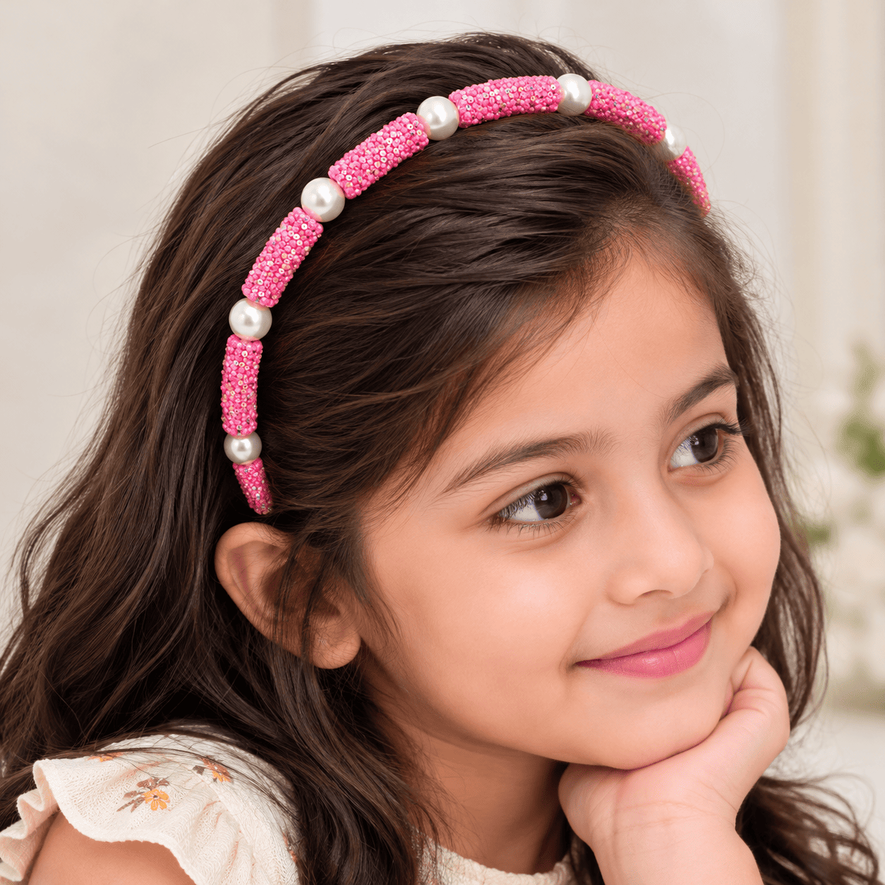Girl with a Sparkly Pink Pearl Headband